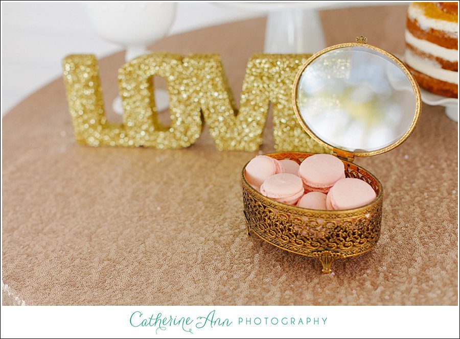 wedding dessert table with pink macarons