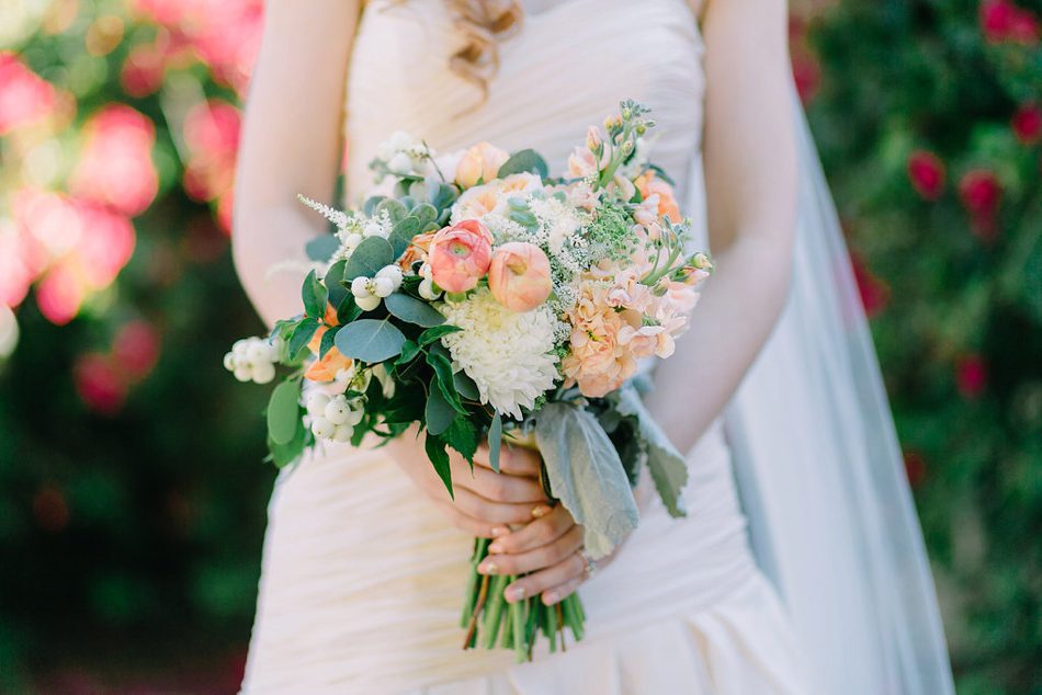 bride holding her colorful bouquet 