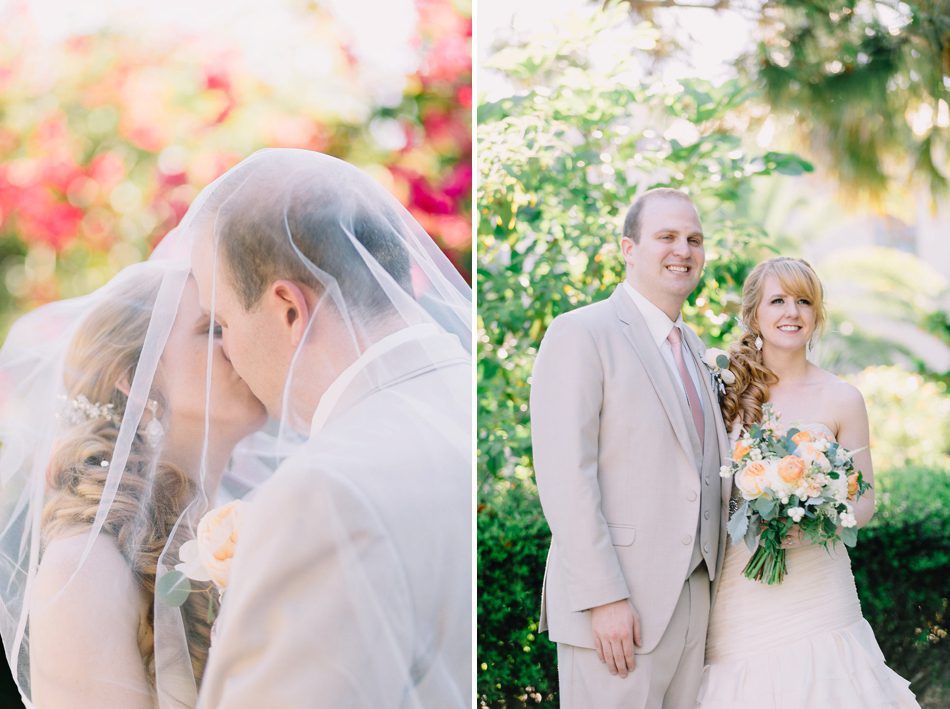 photo of bride and groom kissing under veil 