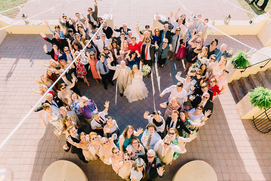 photo of guests making a heart shape at wedding 