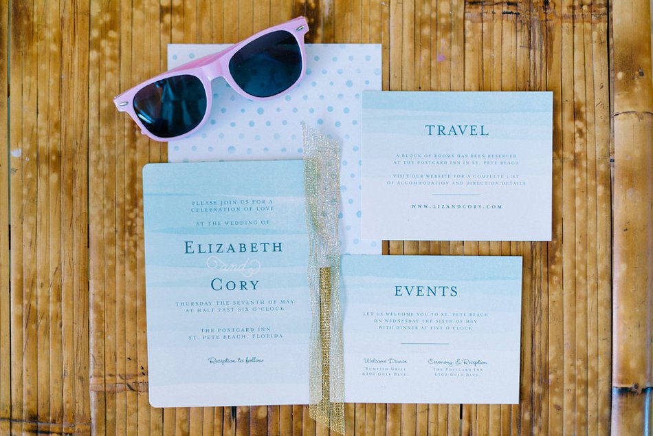 Watercolor blue wedding invitation set for a destination Florida beach wedding with pink sunglasses. Destination Wedding at the Postcard Inn St Pete Beach by Catherine Ann Photography