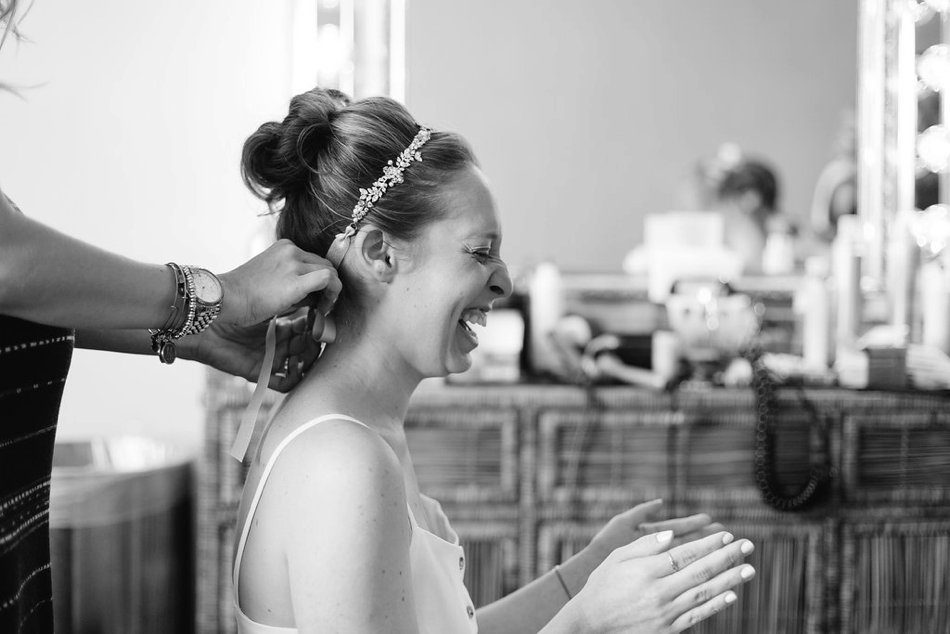 black and white photo of authentic joyful bride. Destination Wedding at the Postcard Inn St Pete Beach by Catherine Ann Photography