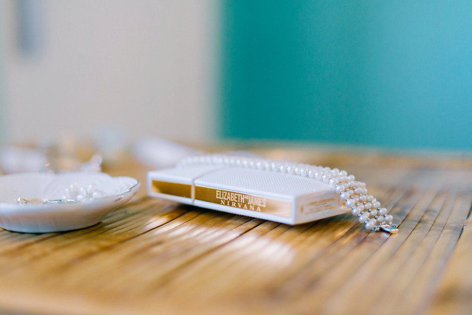 Elizabeth James Nirvana perfume with pearl bracelet for the bride