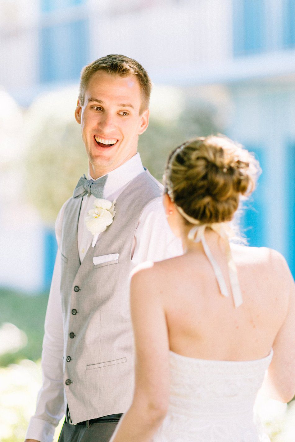 Priceless grooms reaction to seeing the bride during the first look. Destination wedding at the Postcard Inn on the Beach by Catherine Ann Photography