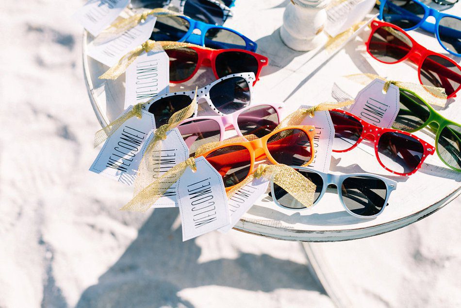 Sunglasses for guests at a beach wedding ceremony in Tampa FL at the Postcard Inn. Destination wedding at the Postcard Inn on the Beach by Catherine Ann Photography