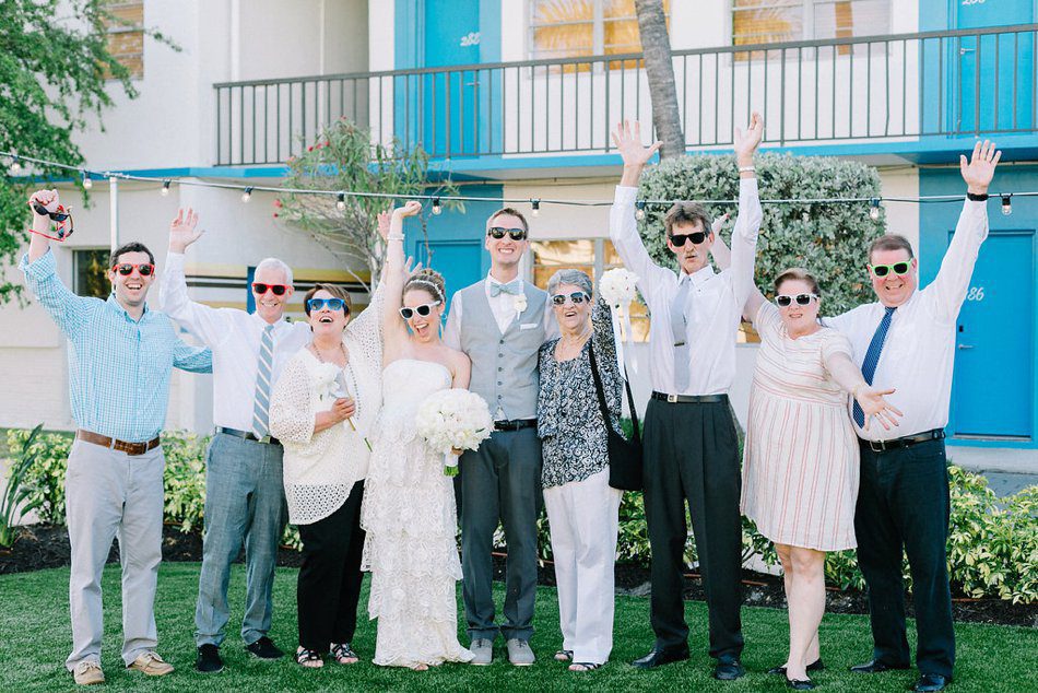 Non traditional fun family portrait with everyone wearing sunglasses