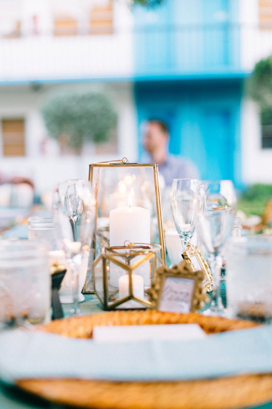 Beautiful blue and gold vintage inspired candle lit reception in a garden. 