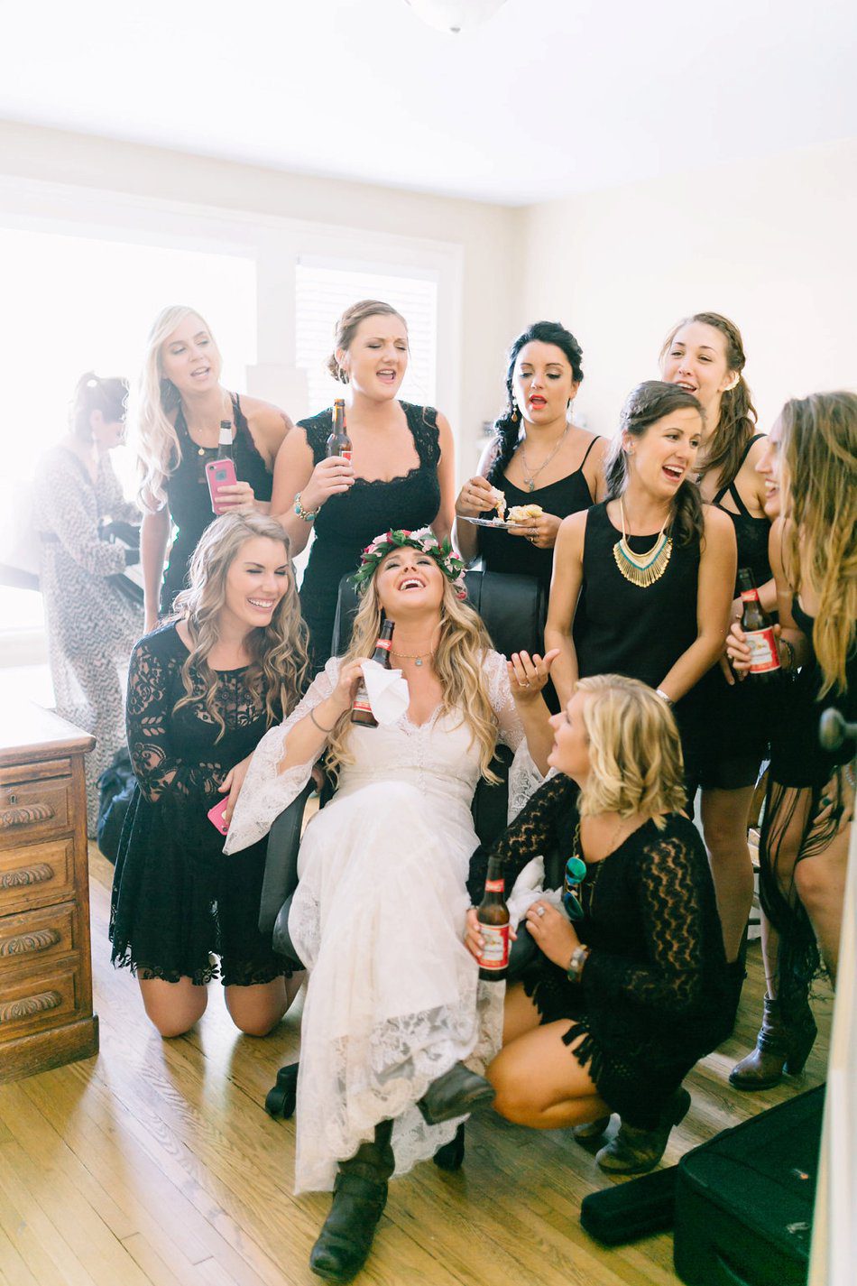 candid moment of bride and bridesmaids singing