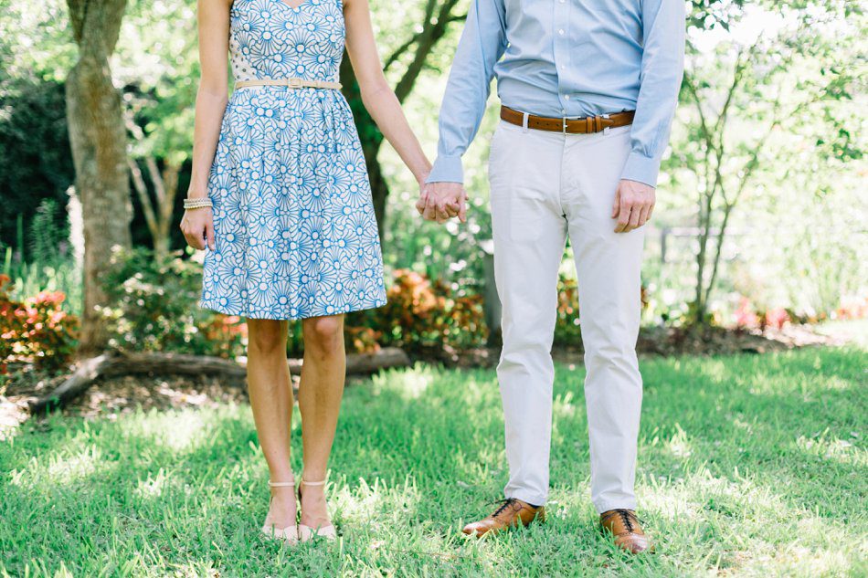 detail photo of couple holding hands