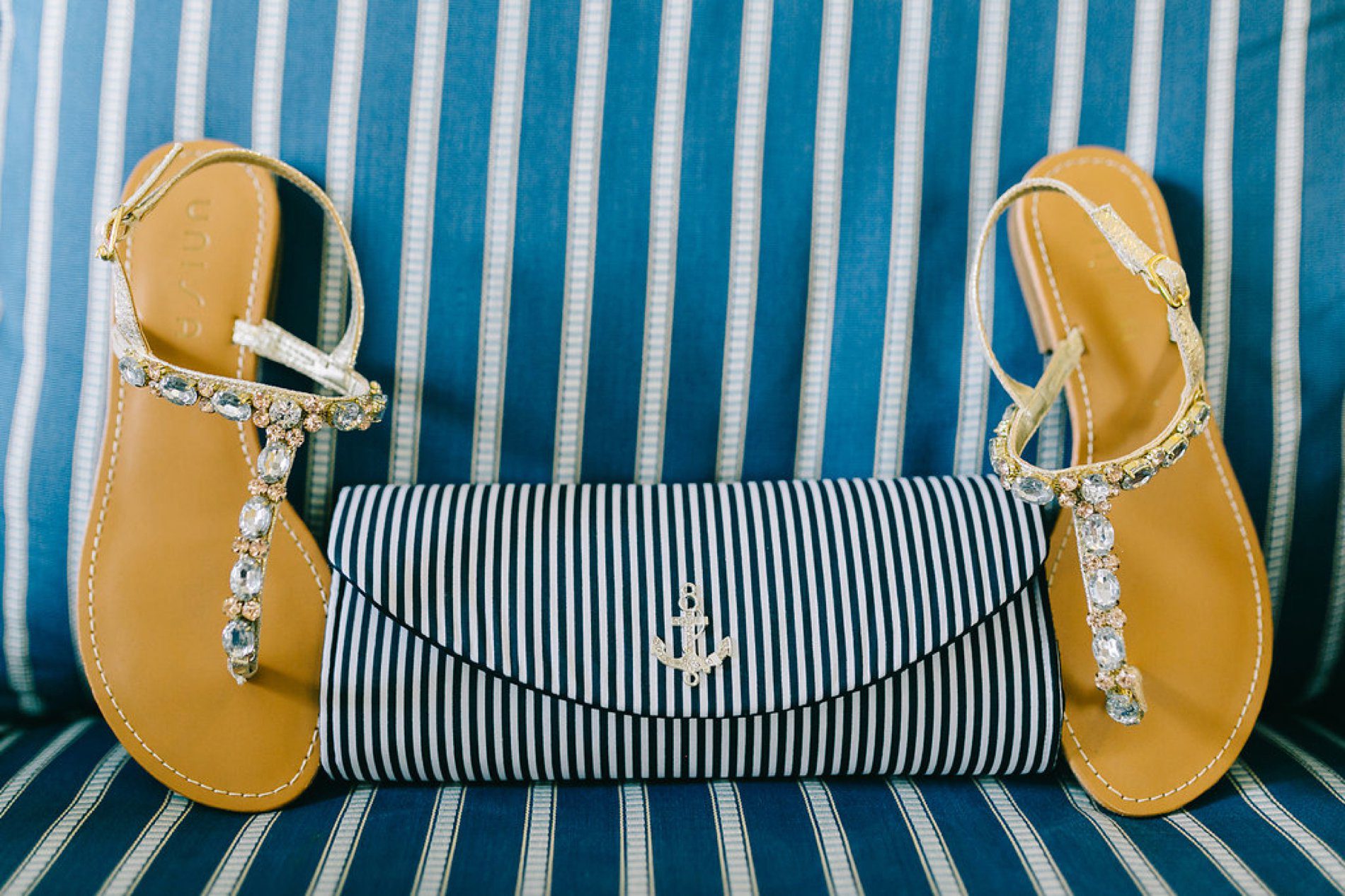 Brides jeweled sandals and striped nautical clutch