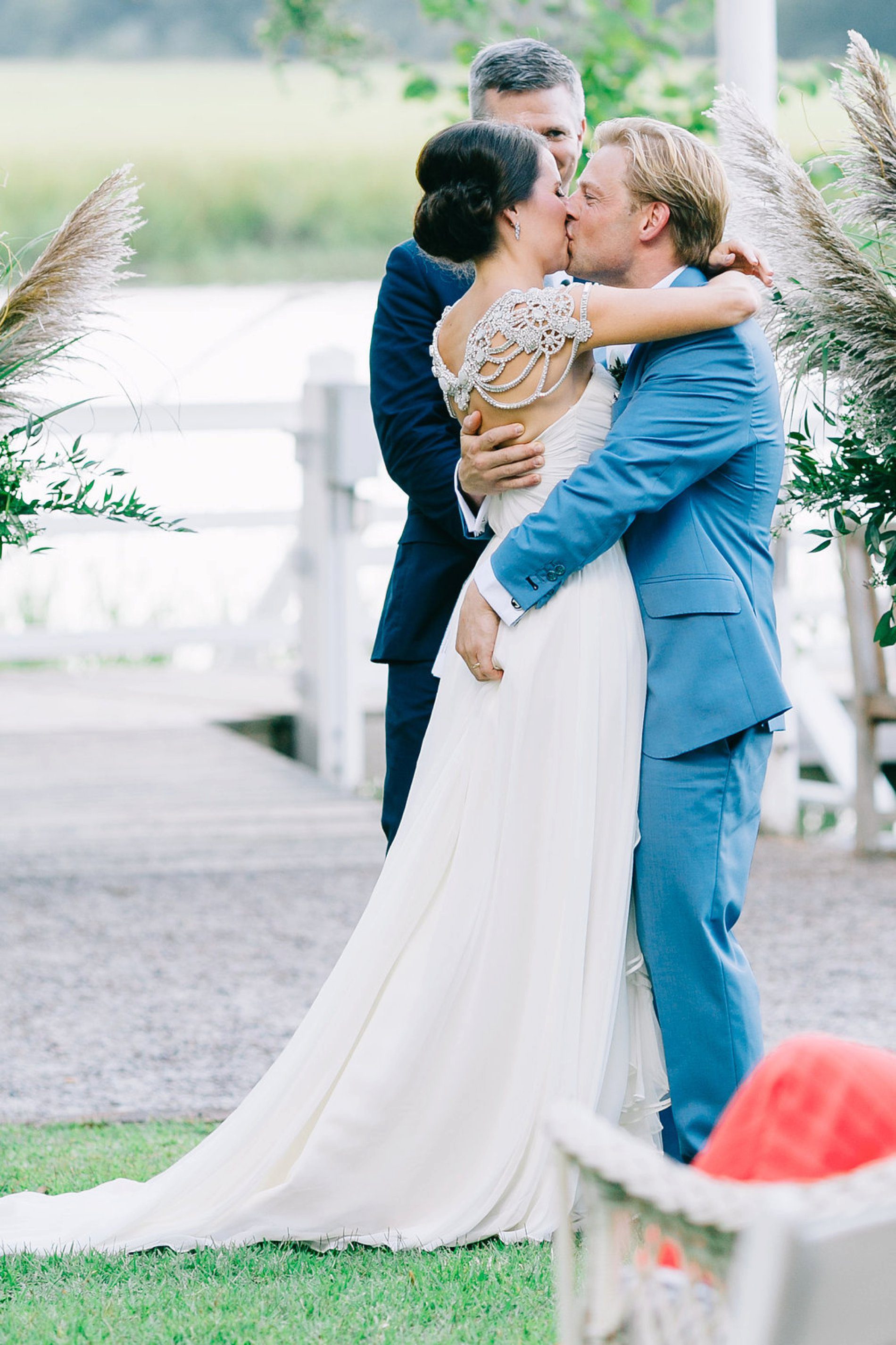 Photo of the bride and grooms first kiss as husband and wife