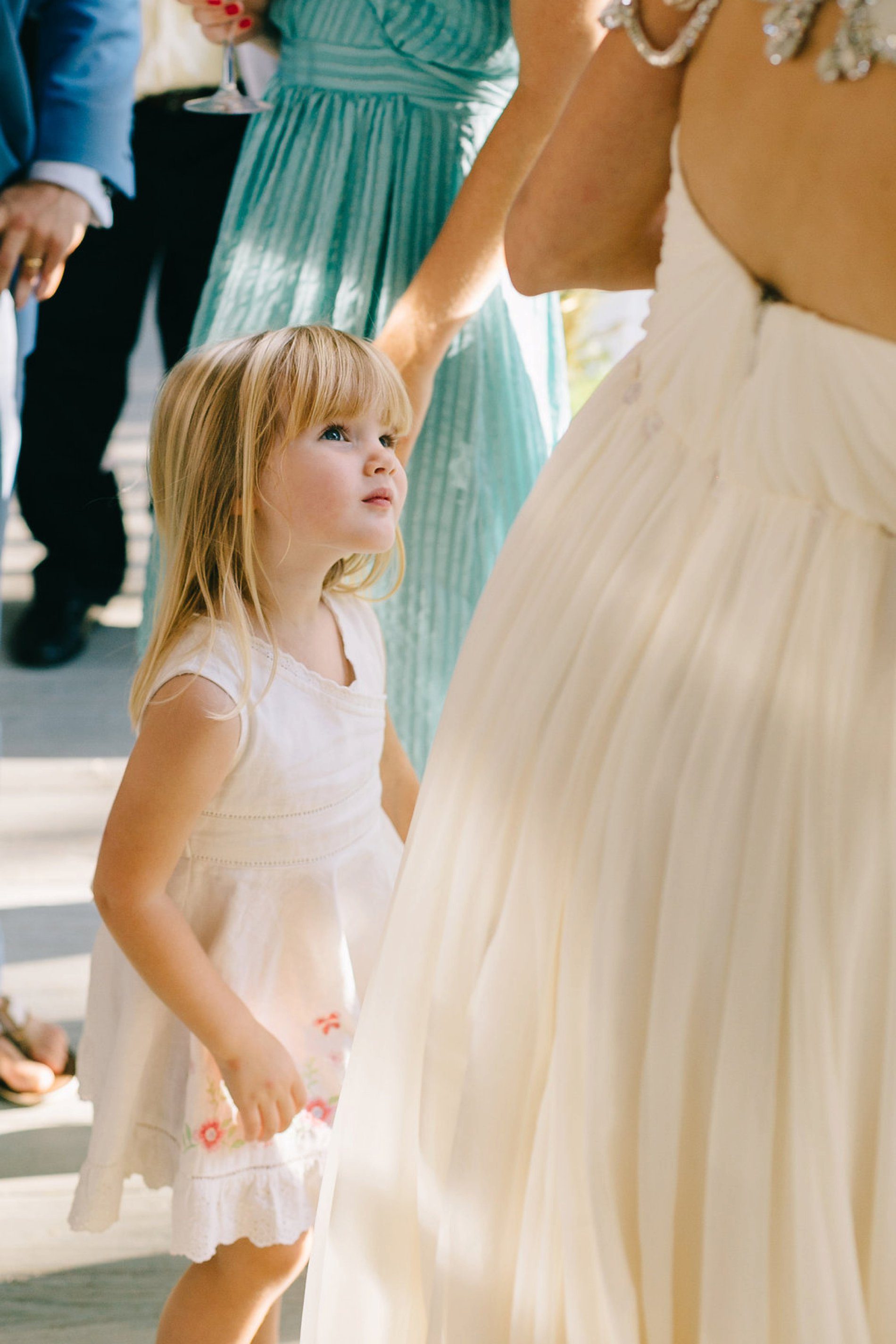 Cute photo of a little girl admiring the bride