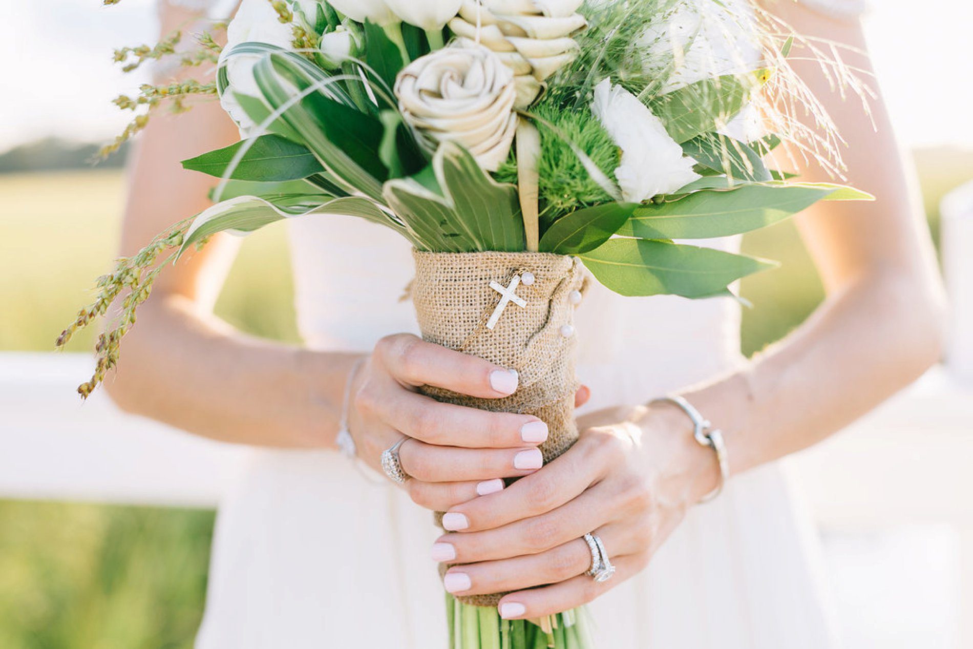 Brides bouquet with her grandmothers necklace attached 