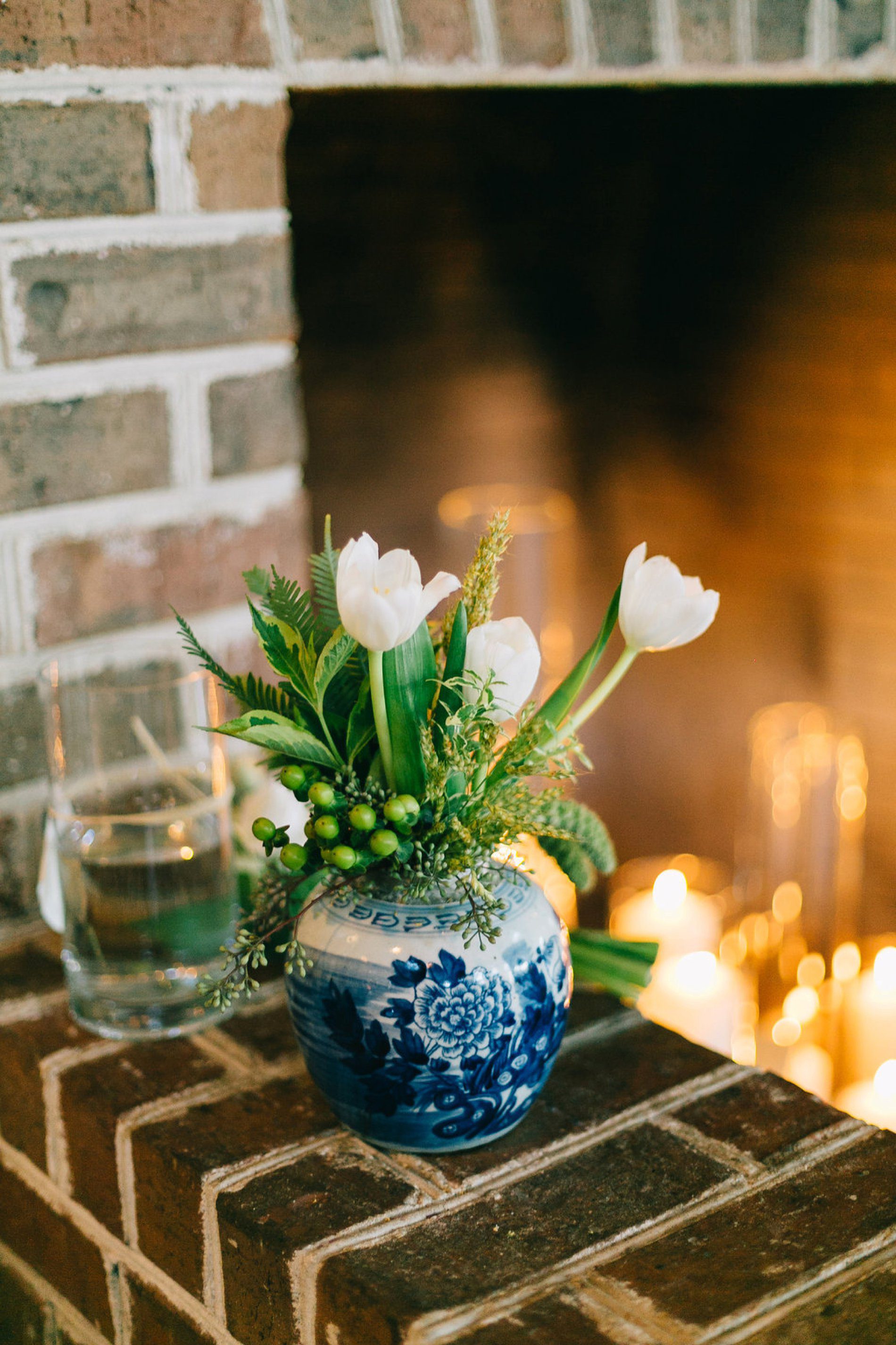 Wedding reception photo of tulips in a blue and white Dutch vase
