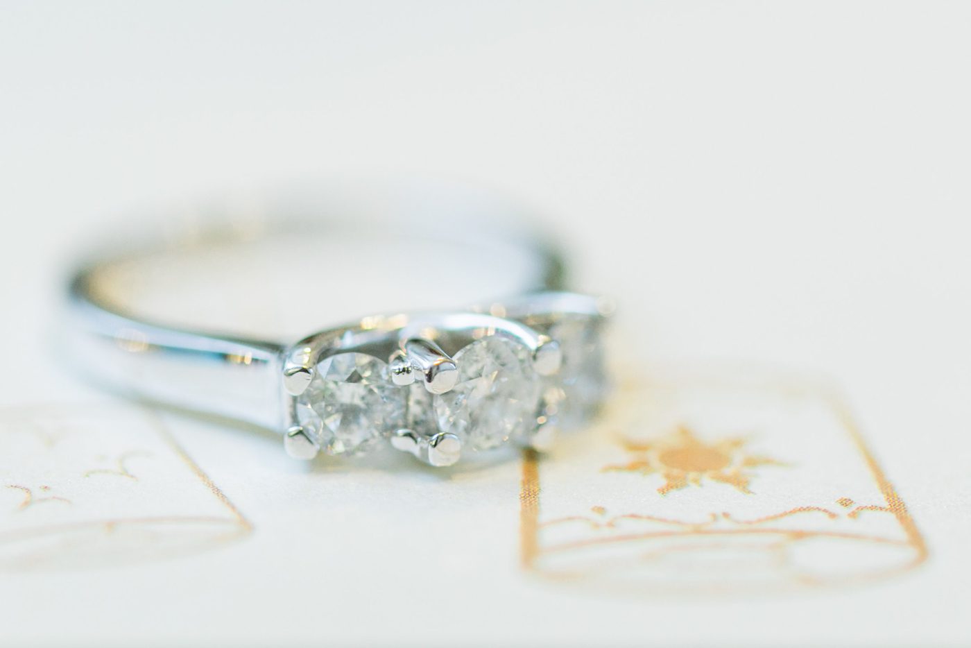 Engagement ring on Tangled themed wedding invitation