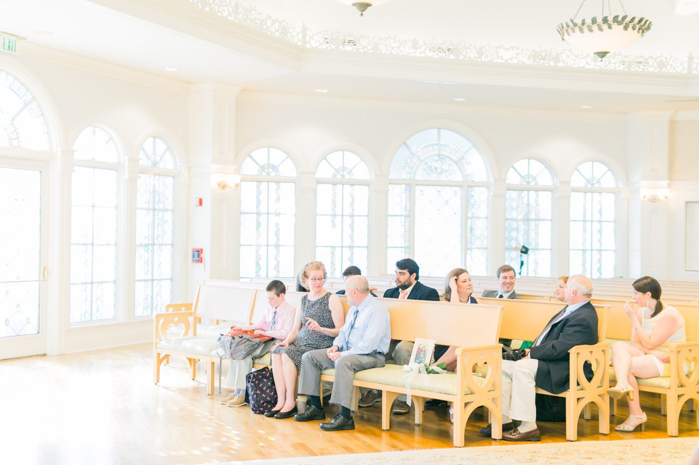 Guests sitting in Disneys wedding pavilion for wedding ceremony 