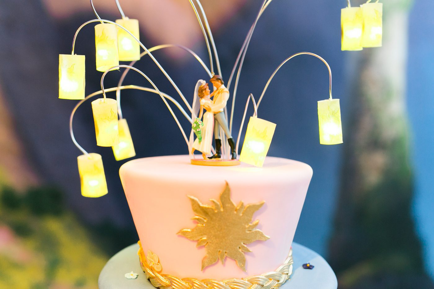 Tangled themed wedding cake with Flynn and Rapunzel cake topper 