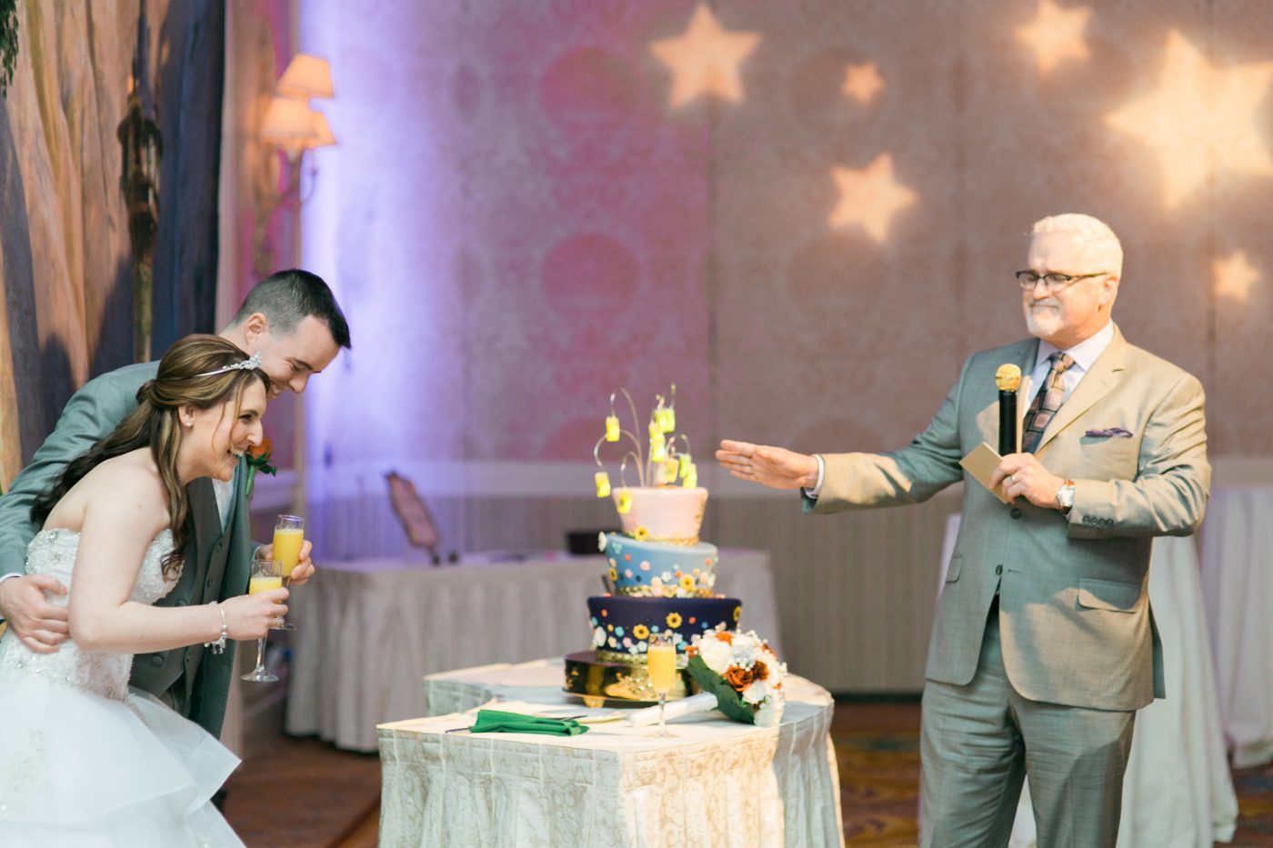 Couple laughing during wedding toasts 
