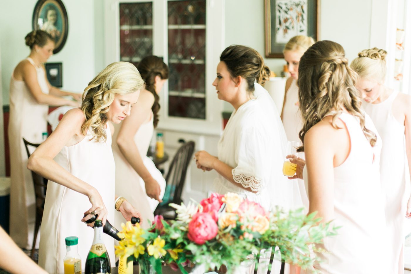 Bride and bridesmaids sipping on mimosas at Oak Manor Inn in Hartsville. Photo by Charleston wedding photographer Catherine Ann Photography