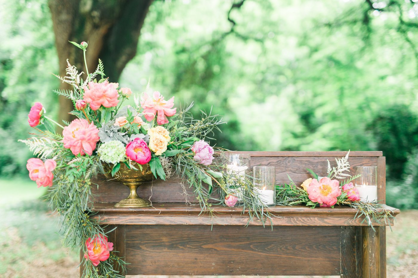 Antique fireplace mantel wedding decor idea with beautiful flowers and candles. Photo by Charleston wedding photographer Catherine Ann Photography