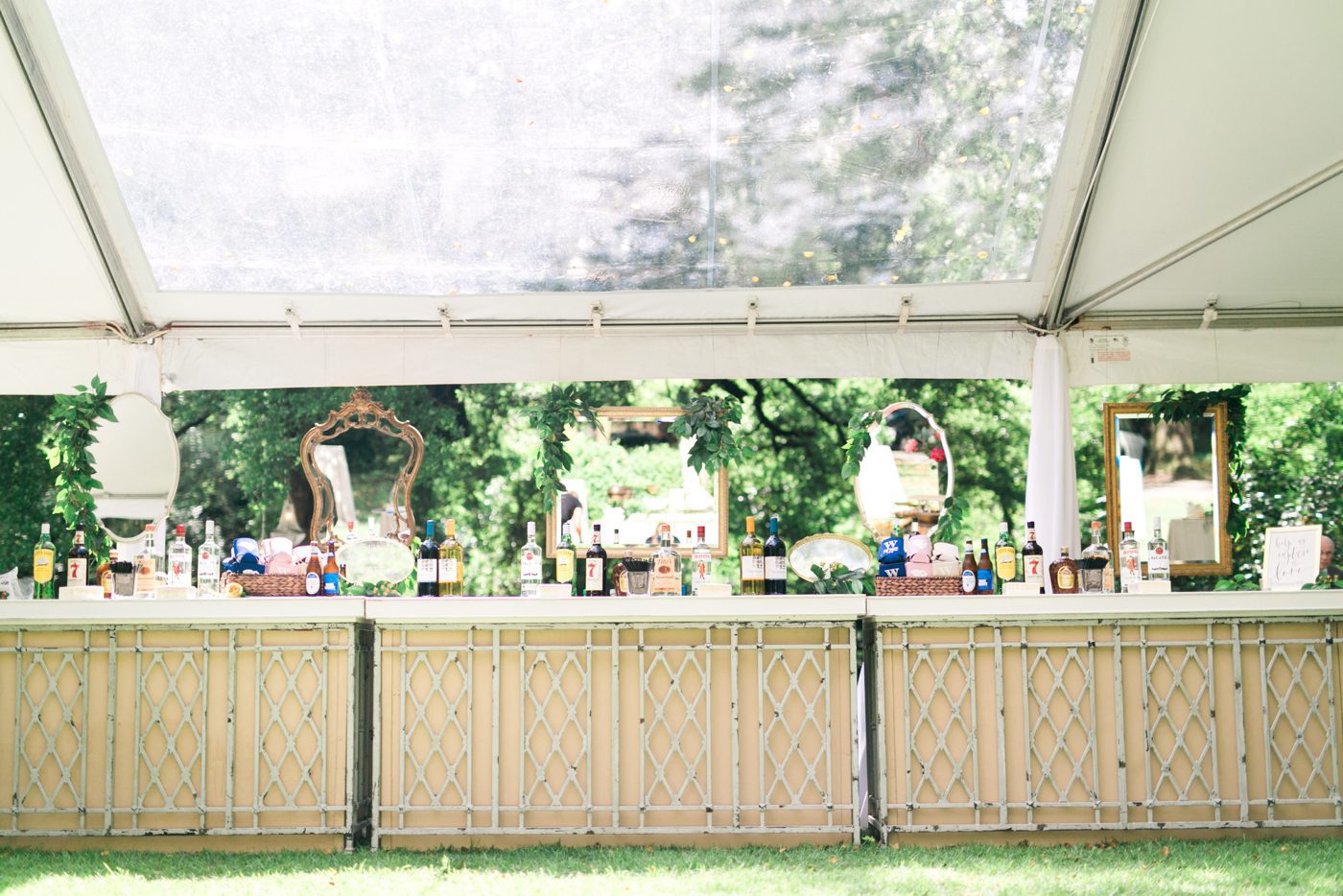 Wedding bar with hanging mirrors. Photo by Charleston wedding photographer Catherine Ann Photography