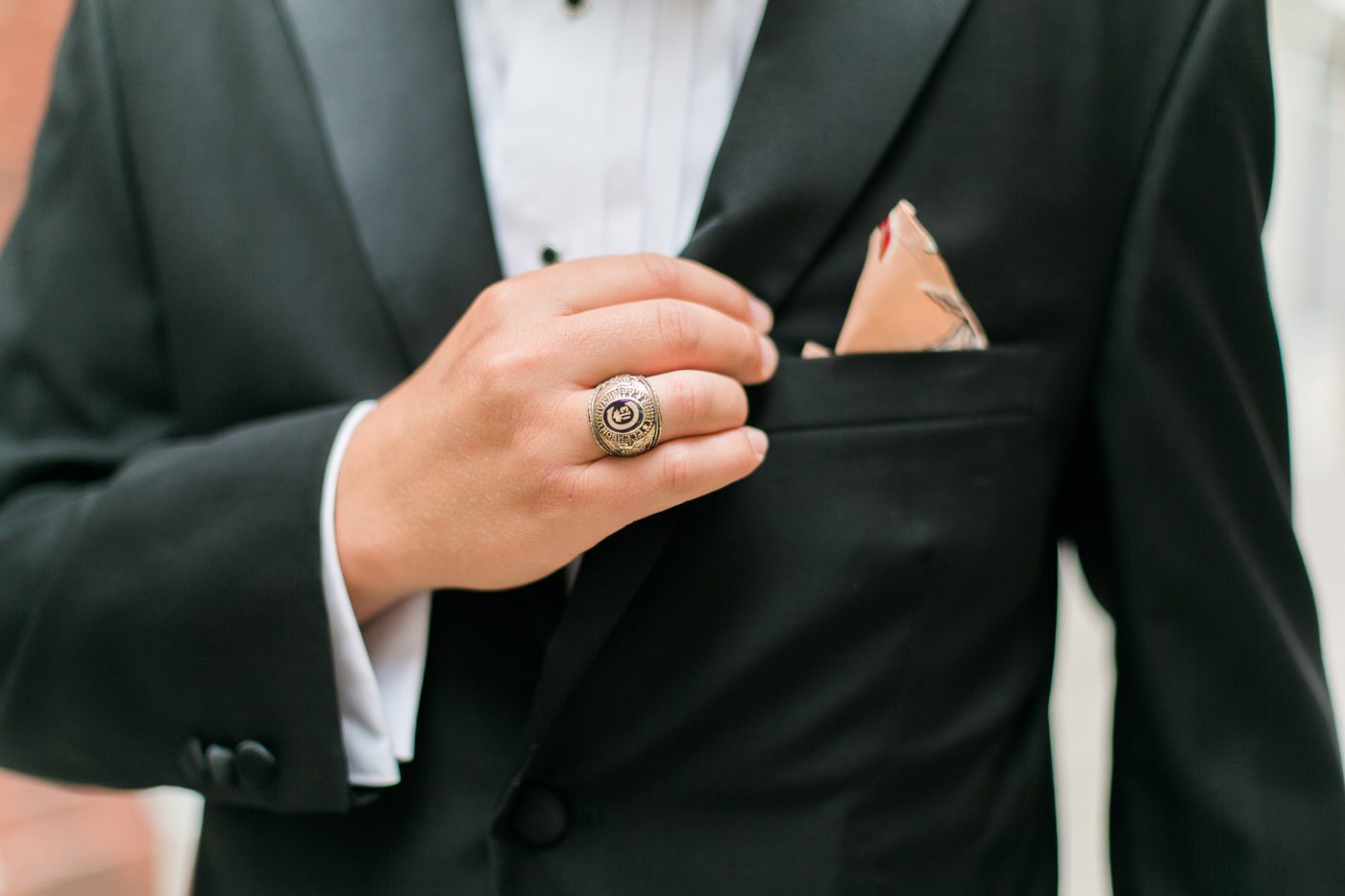 Groom detail photo of his Citadel graduation ring. Photo by Charleston wedding photographer Catherine Ann Photography