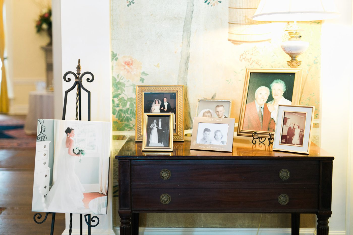 Vintage wedding photo table at a southern wedding. Photo by Charleston wedding photographer Catherine Ann Photography
