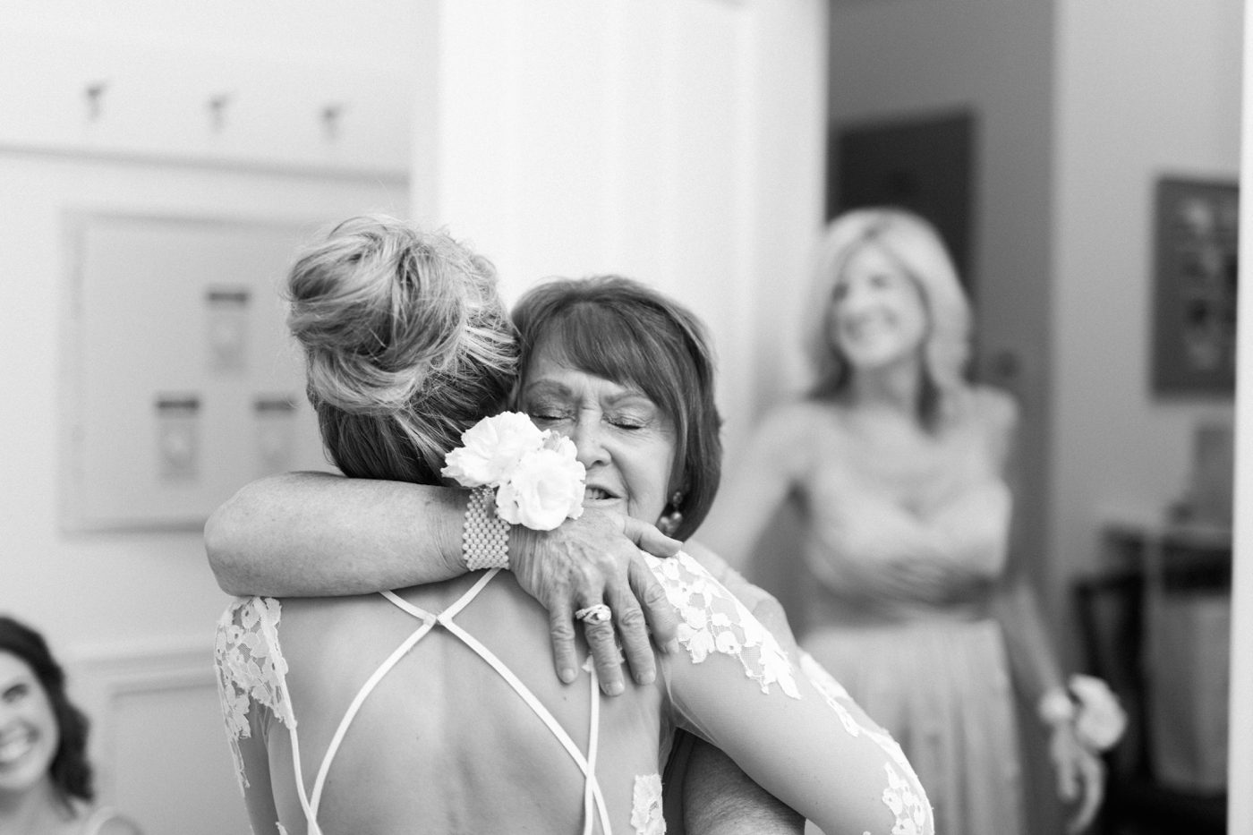 Emotional wedding photography. Grandmother hugging the bride before she walks down the aisle. Photo by Charleston wedding photographer Catherine Ann Photography
