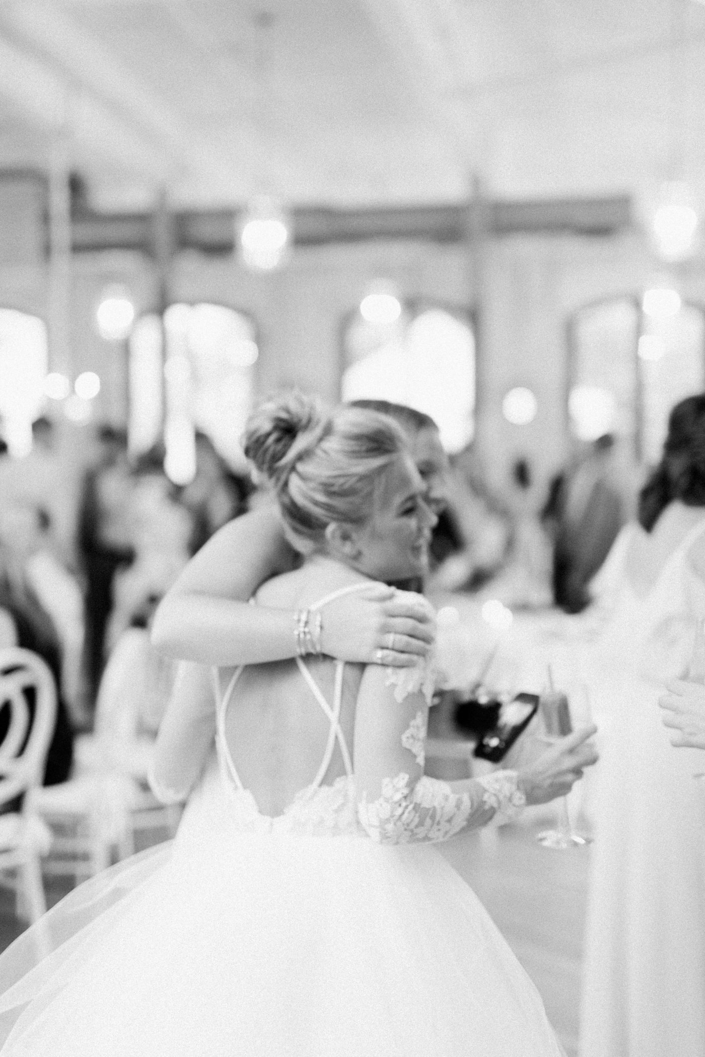 Bride hugging her friend