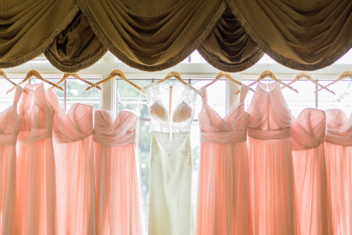 Wedding dress hanging in a window 