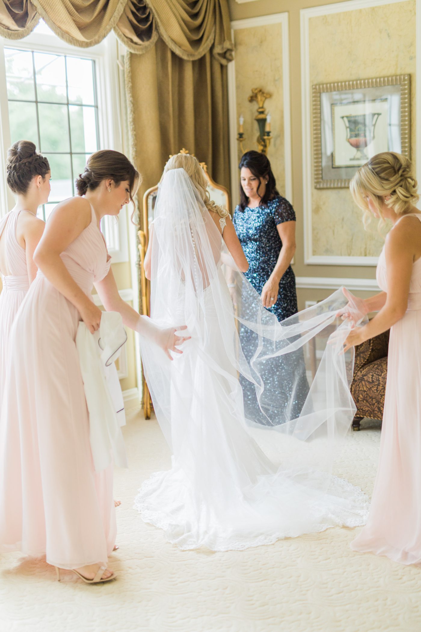 Photo of bridesmaids helping the bridge get ready for New York wedding