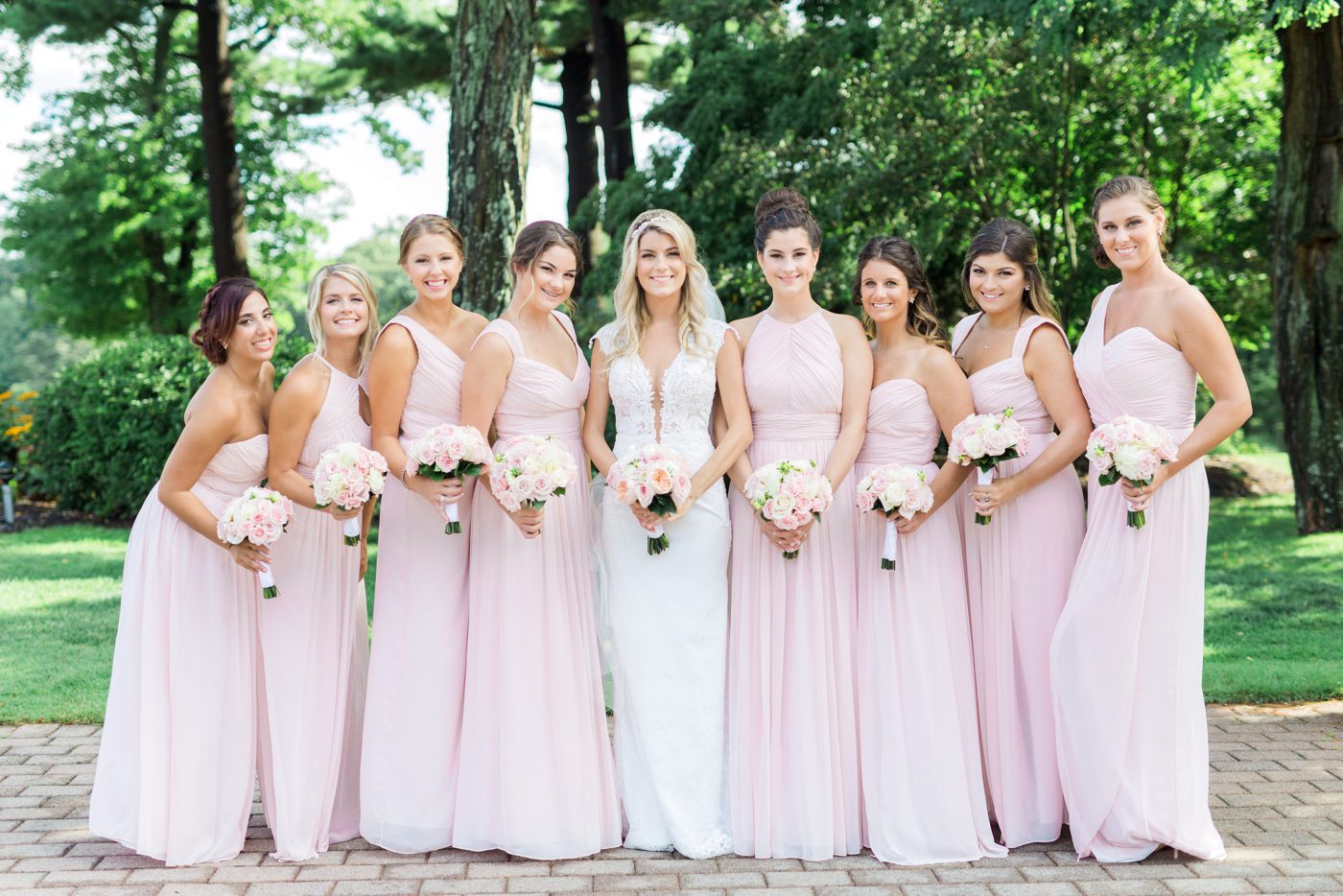 New York bride with her bridesmaids wearing long blush gowns 