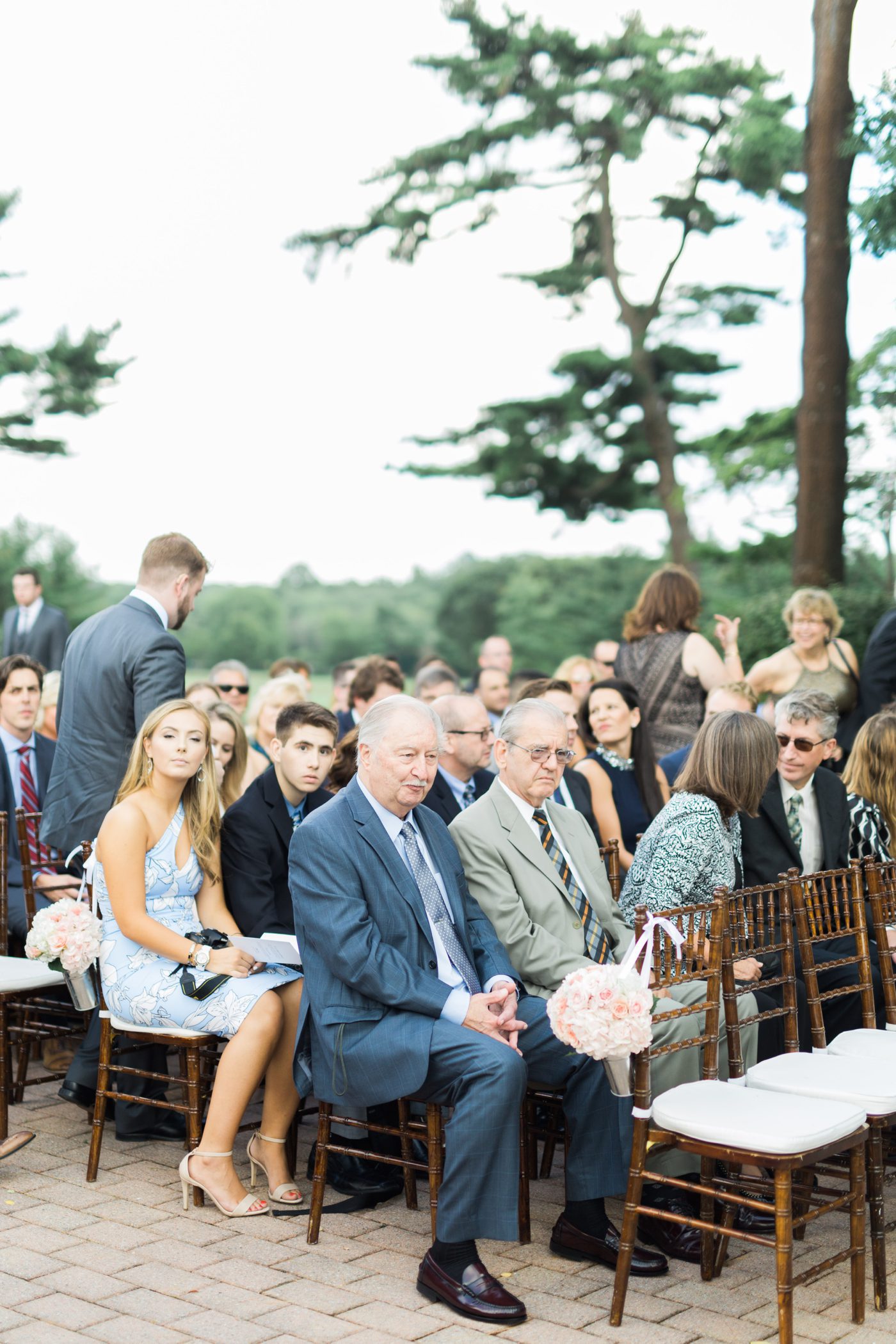 Wedding guests at outdoor ceremony