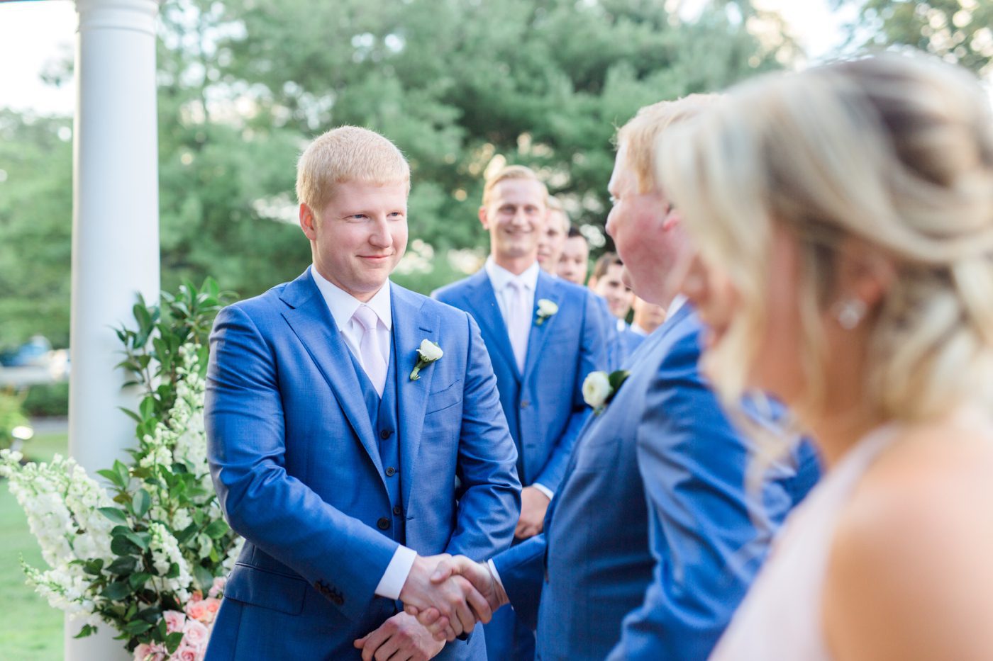 Groom and his brother shaking hands 