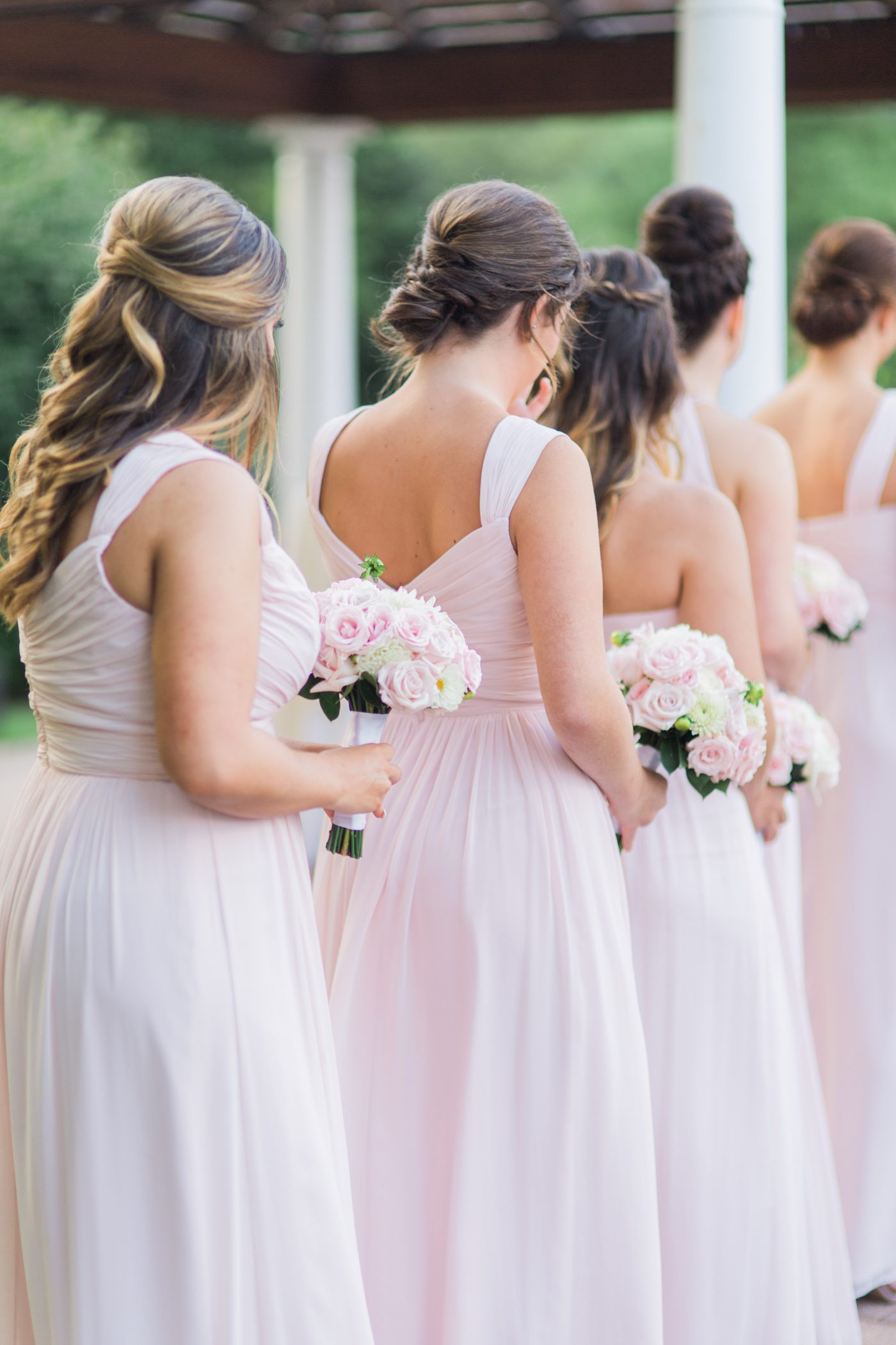 Bridesmaids standing at the ceremony