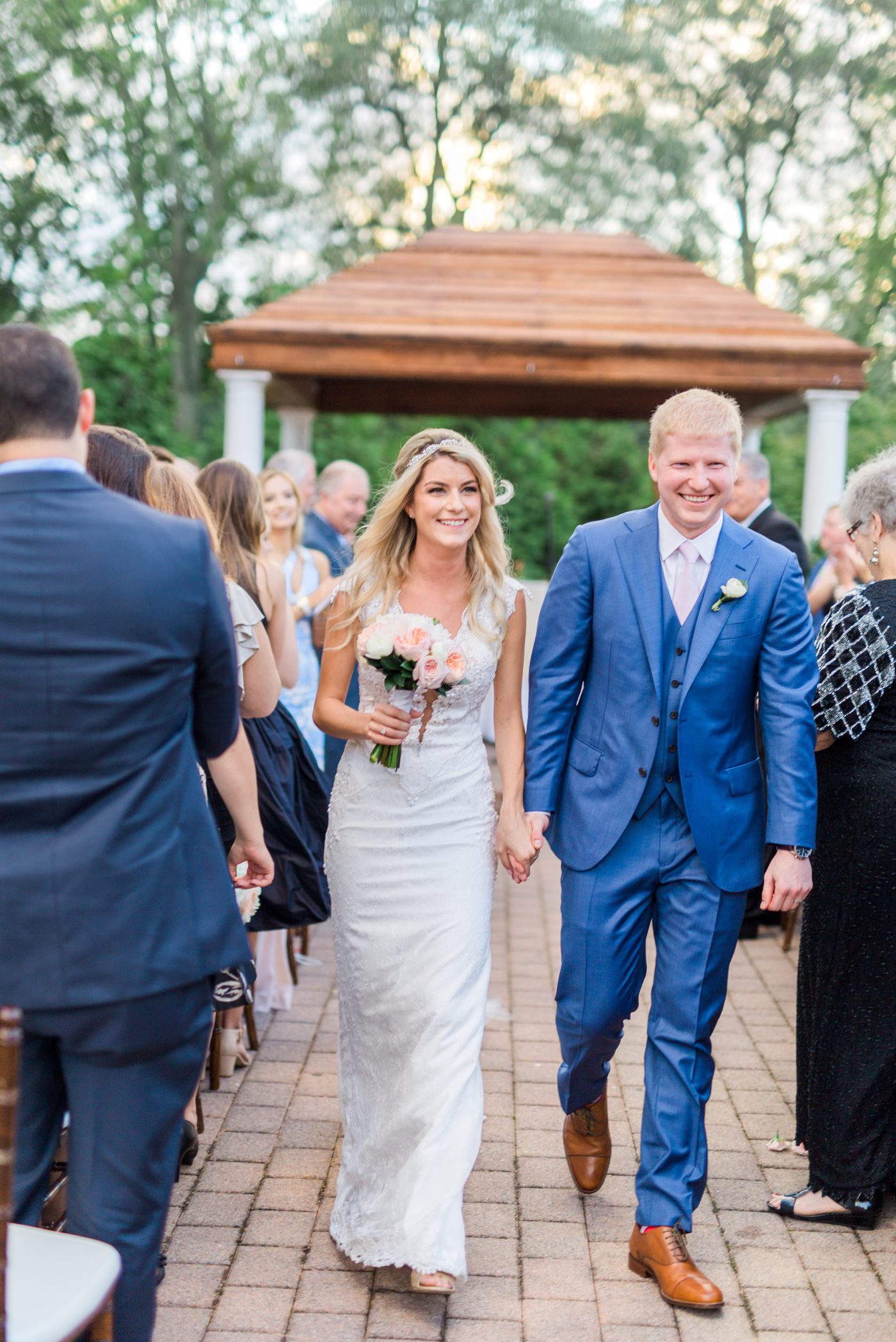 Photo of married couple walking down the aisle