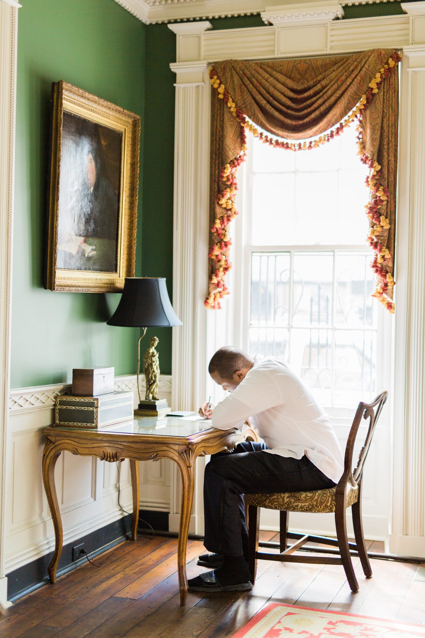 Groom writing a note to his bride | Elegant William Aiken House Wedding Photos | Charleston SC wedding photographers Catherine Ann Photography
