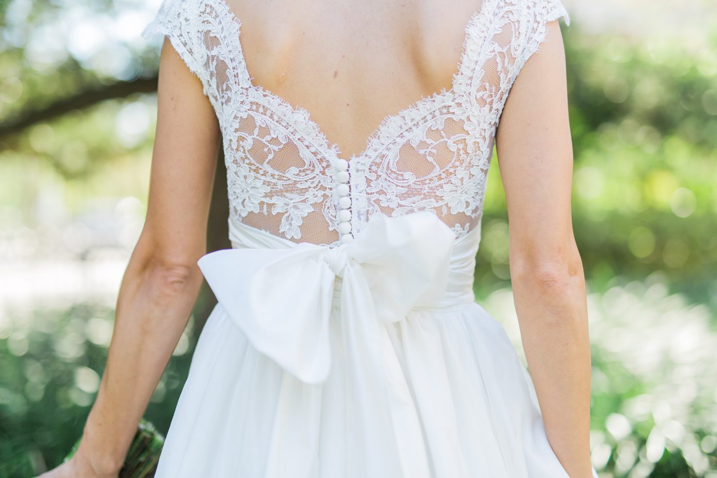 Lace wedding dress back with bow for a southern wedding in Charleston SC | Elegant William Aiken House Wedding Photos | Charleston SC wedding photographers Catherine Ann Photography