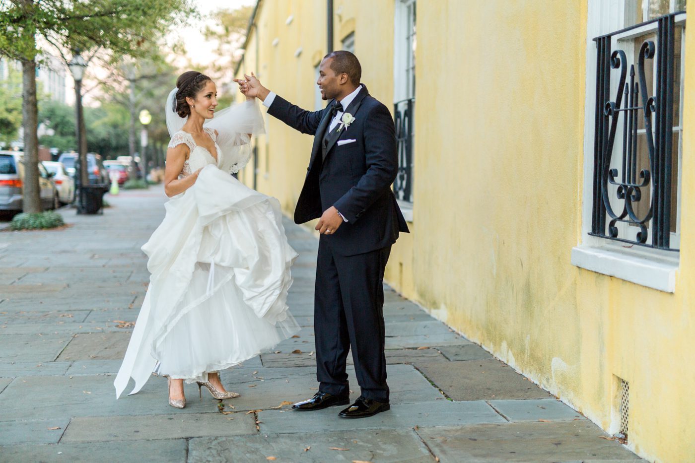Groom twirling bride photo | Elegant William Aiken House Wedding Photos | Charleston SC wedding photographers Catherine Ann Photography