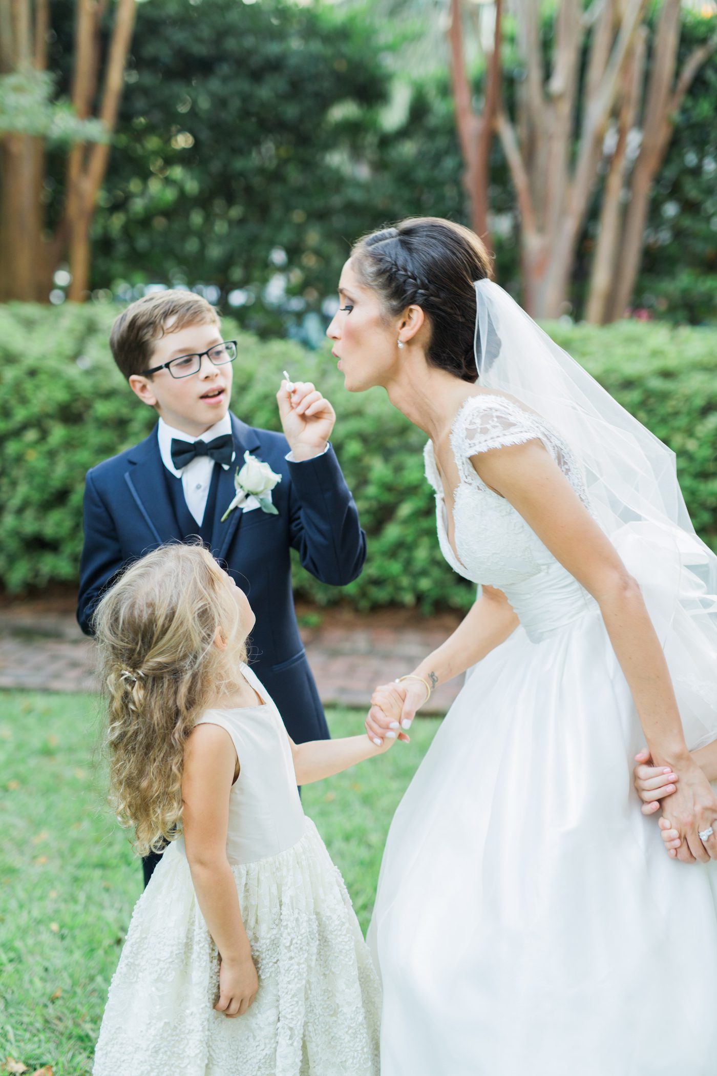 Fun wedding picture bride blowing bubbles | Elegant William Aiken House Wedding Photos | Charleston SC wedding photographers Catherine Ann Photography