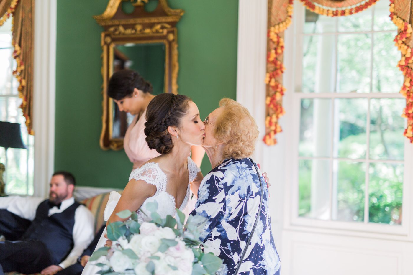 Bride kissing her grandmother | Elegant William Aiken House Wedding Photos | Charleston SC wedding photographers Catherine Ann Photography