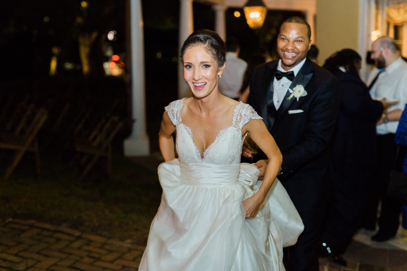 Joyful married couple at their Charleston SC wedding reception by Catherine Ann Photography