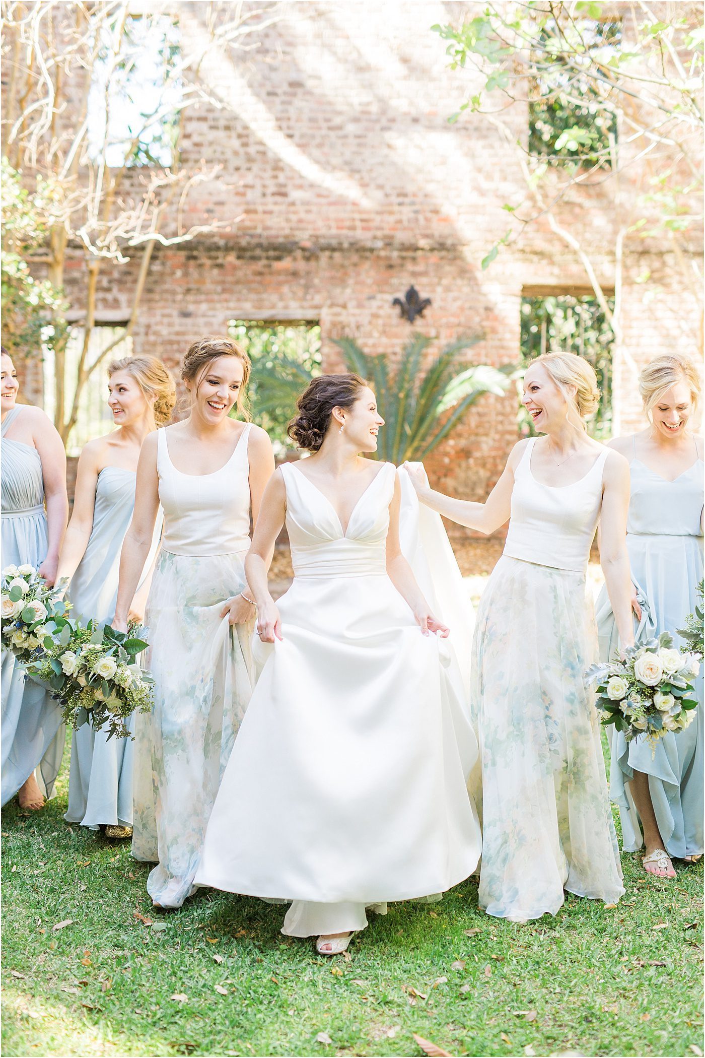 Photo of bridesmaids walking | French Huguenot Church Charleston Wedding Photos | Charleston SC wedding photographer Catherine Ann Photography
