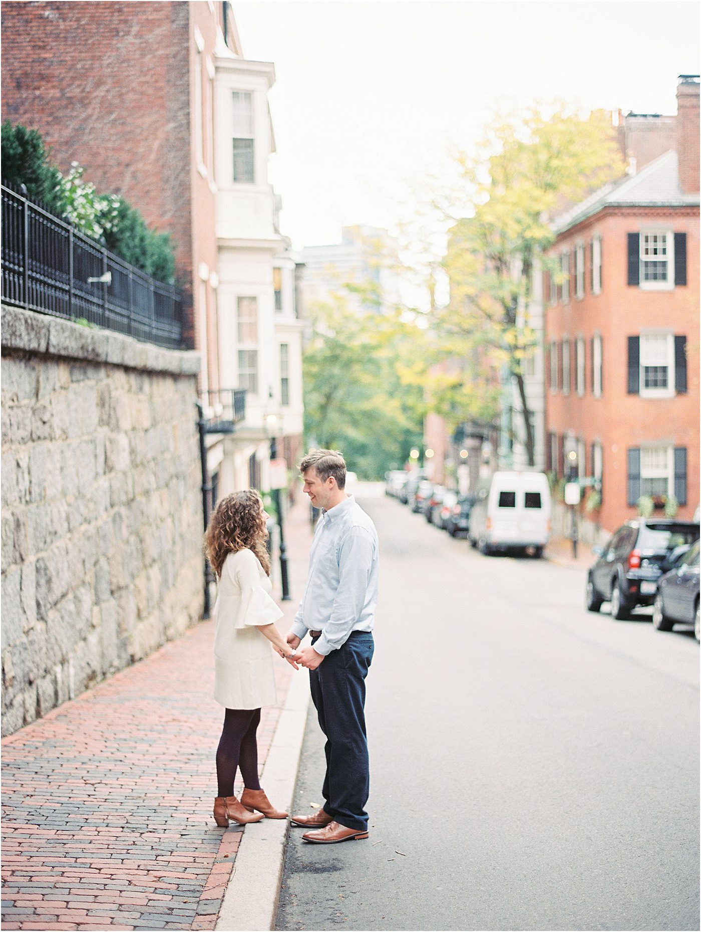 Engaged couple holding hands in Beacon Hill | Catherine Ann Photography