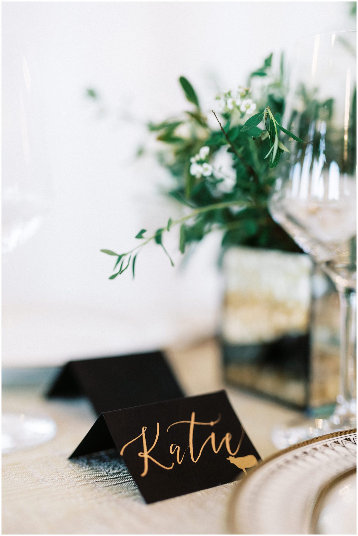 modern black wedding escort card with gold calligraphy 