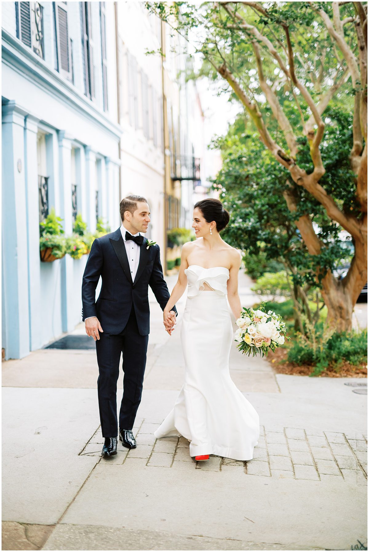 Rainbow Row wedding portrait of the couple walking