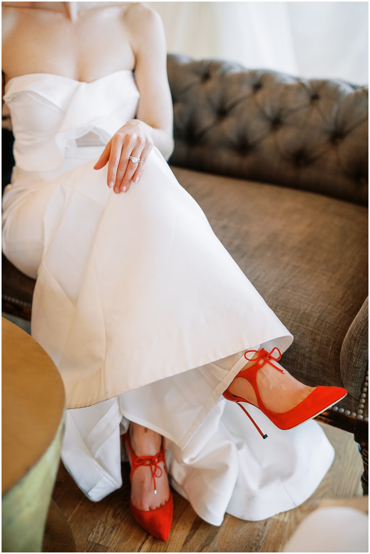 A modern chic bride wearing red Jimmy Choo shoes at her wedding in Charleston