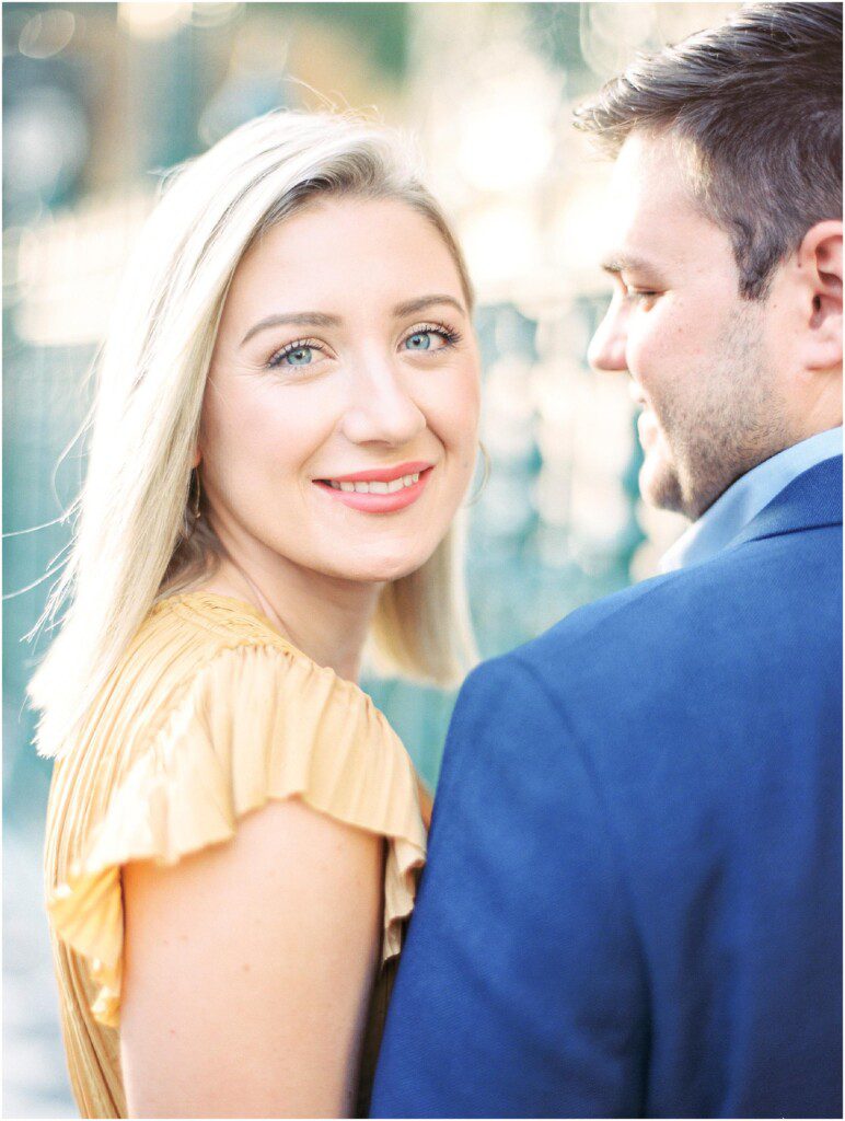 Destination engagement pictures in Charleston with yellow dress by film photographer Catherine Ann Photography