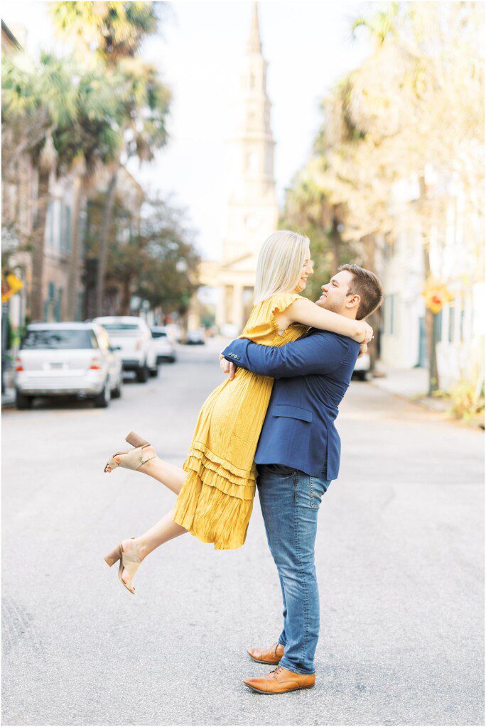 Destination engagement pictures in Charleston with yellow dress by film photographer Catherine Ann Photography