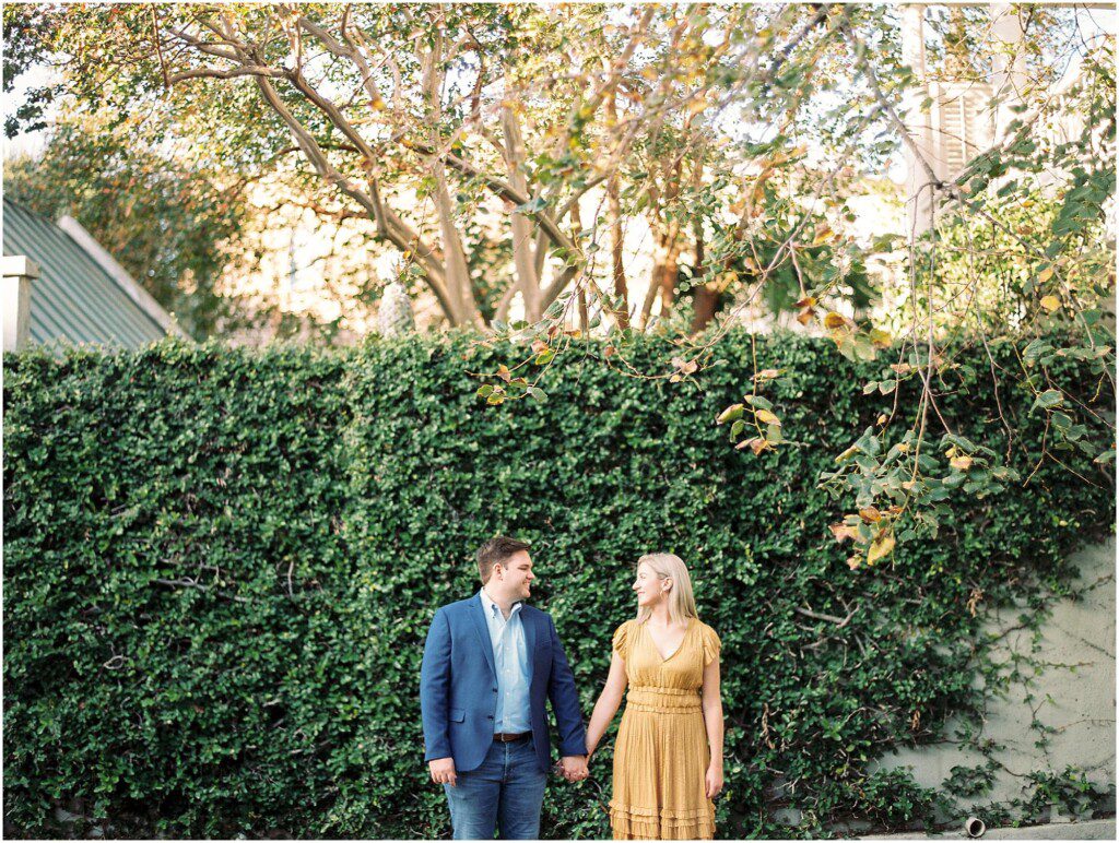 Destination engagement pictures in Charleston with yellow dress by film photographer Catherine Ann Photography